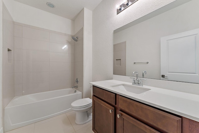 full bathroom featuring tile patterned flooring, tiled shower / bath combo, toilet, and vanity