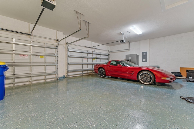 garage featuring a garage door opener and electric panel