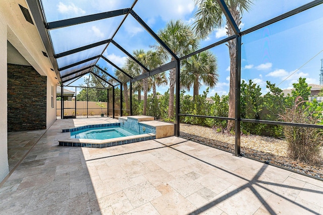 view of swimming pool with a lanai, a patio area, and an in ground hot tub