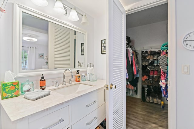 bathroom featuring hardwood / wood-style flooring and vanity