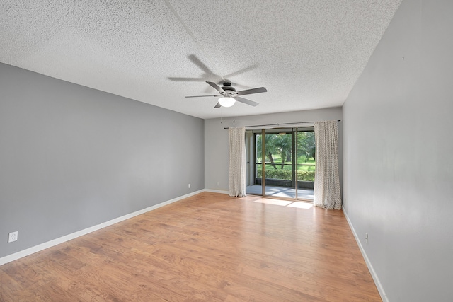 unfurnished room featuring ceiling fan, a textured ceiling, and light wood-type flooring