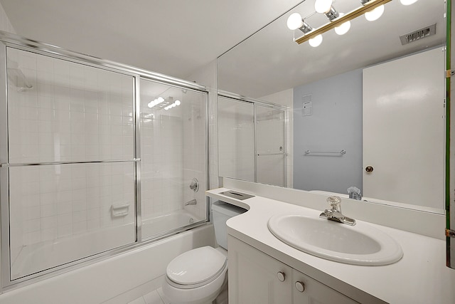 full bathroom with vanity, toilet, and bath / shower combo with glass door