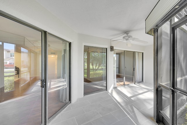 interior space with french doors and ceiling fan