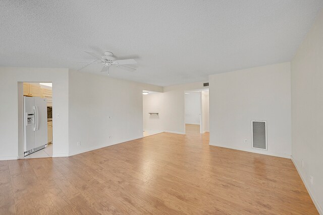 interior space with dark wood-type flooring and a textured ceiling