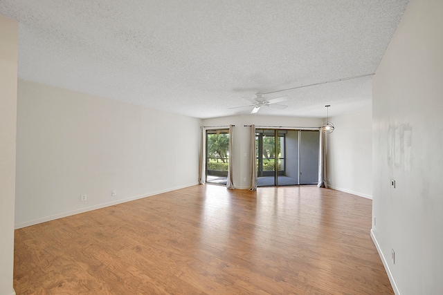 living room featuring dark hardwood / wood-style flooring and a textured ceiling