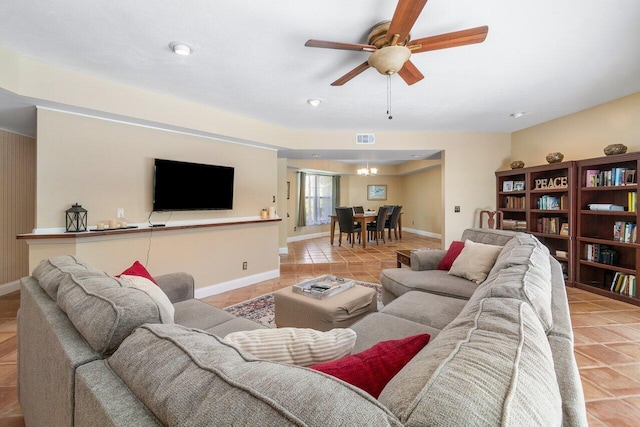 living room featuring tile patterned flooring and ceiling fan