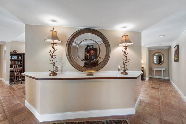 hallway with light tile patterned floors