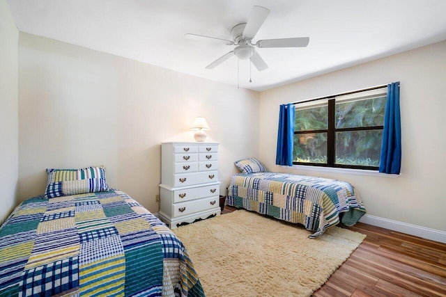 bedroom featuring hardwood / wood-style floors and ceiling fan