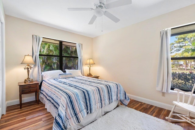 bedroom with ceiling fan and hardwood / wood-style flooring