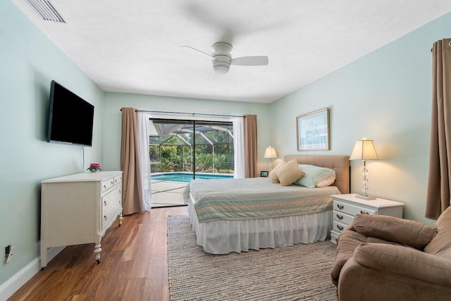 bedroom with dark wood-type flooring, access to outside, and ceiling fan