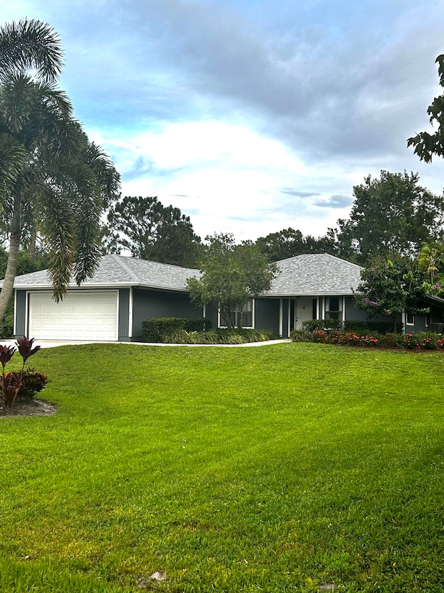 exterior space with a garage and a front yard