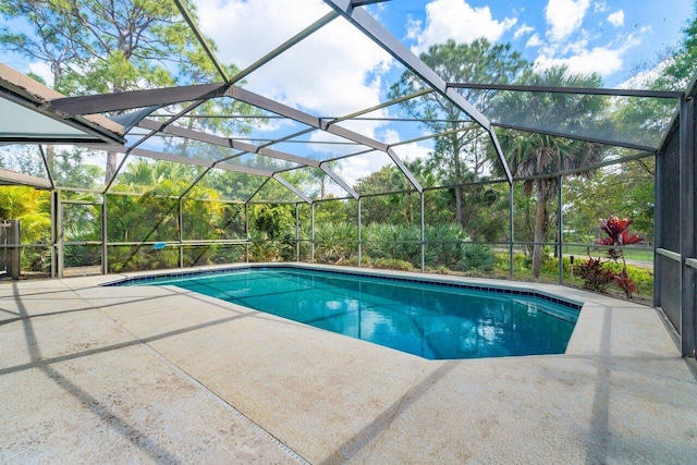 view of pool featuring a lanai and a patio area