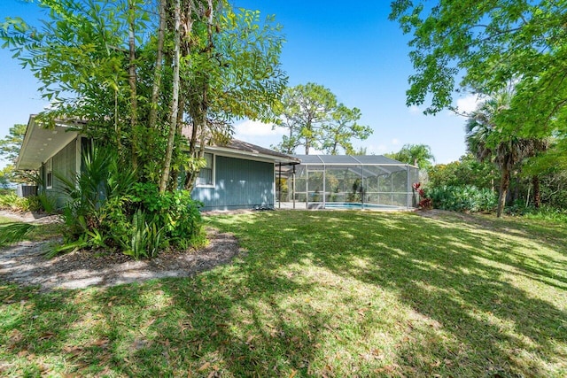 view of yard featuring glass enclosure