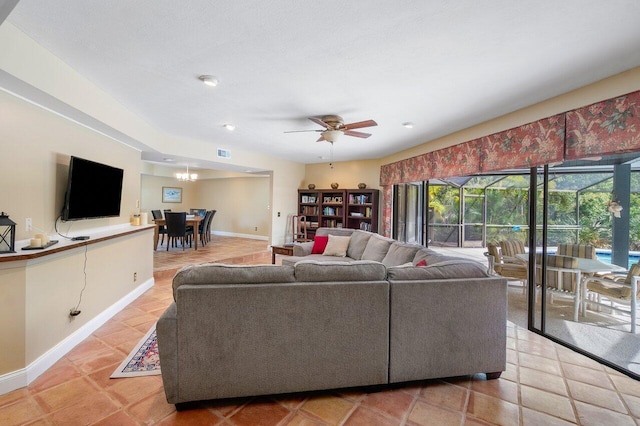 tiled living room with ceiling fan