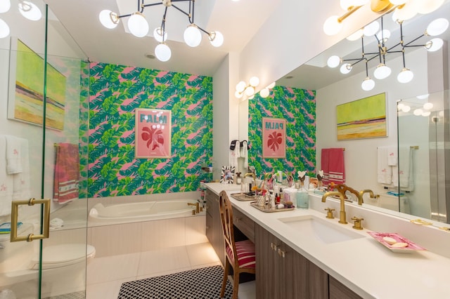 bathroom with tiled bath, tile patterned floors, double sink vanity, and toilet