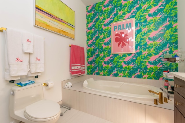 bathroom with vanity, toilet, tile patterned floors, and a bath