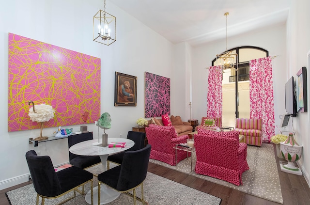 701 S Olive Ave Unit 409, West Palm Beach, FL 33401 - dining room featuring a notable chandelier and wood finished floors