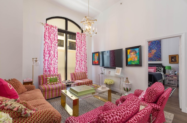 701 S Olive Ave Unit 409, West Palm Beach, FL 33401 - living room featuring wood finished floors and an inviting chandelier