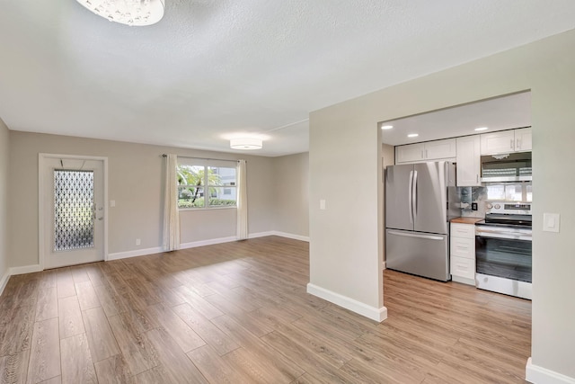 unfurnished living room featuring light wood-type flooring