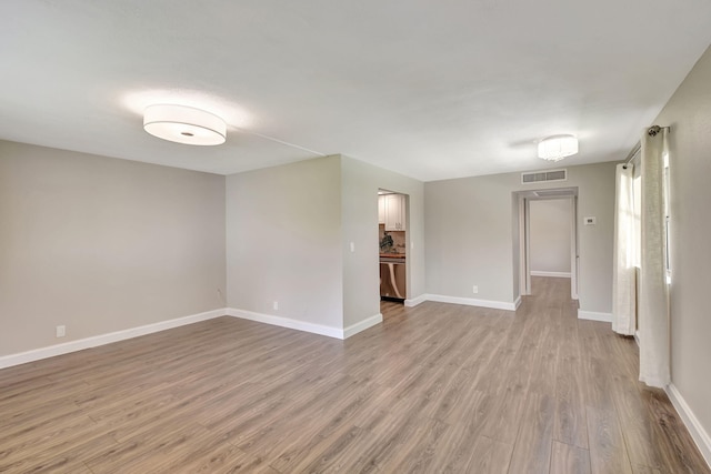 spare room with light hardwood / wood-style floors