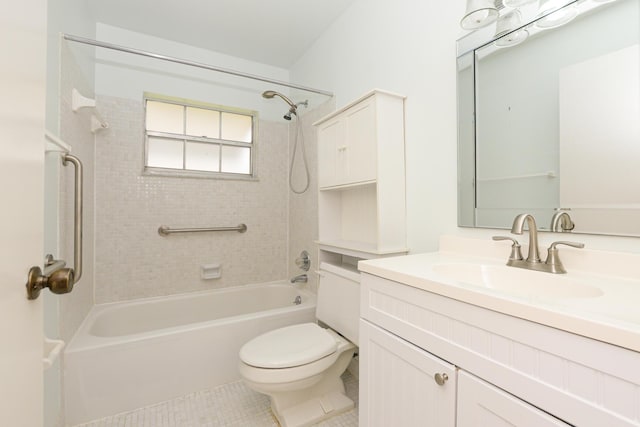 full bathroom featuring tile patterned floors, toilet, vanity, and tiled shower / bath