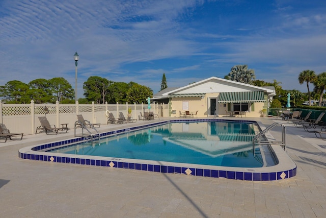 view of swimming pool featuring a patio