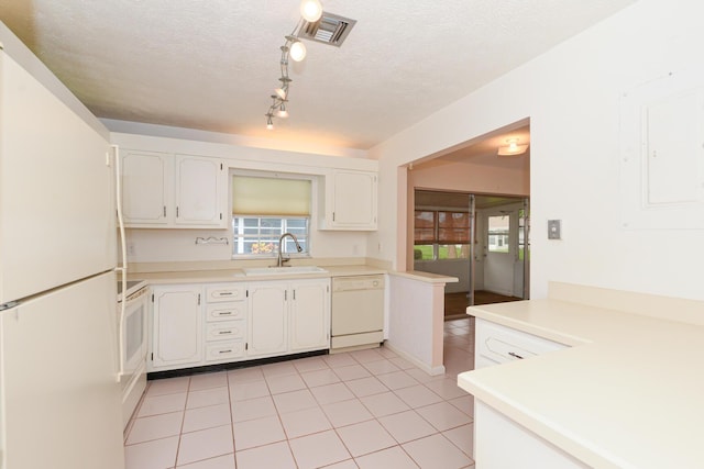 kitchen featuring white appliances, electric panel, sink, a textured ceiling, and white cabinetry