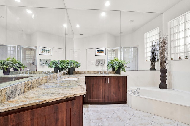 full bathroom with a shower stall, a bath, vanity, and recessed lighting