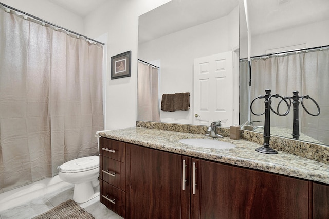 full bathroom with vanity and toilet