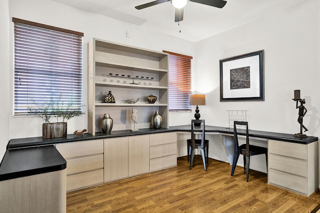 home office featuring ceiling fan and wood finished floors