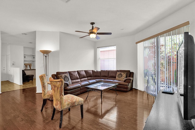 living room with wood finished floors and ceiling fan
