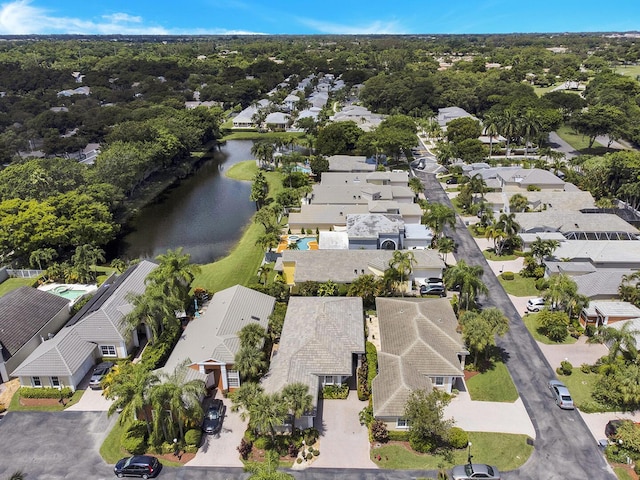 aerial overview of property's location featuring nearby suburban area and a nearby body of water