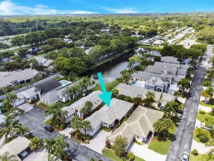 aerial view of residential area featuring a large body of water