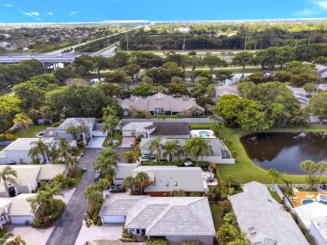aerial perspective of suburban area with a large body of water