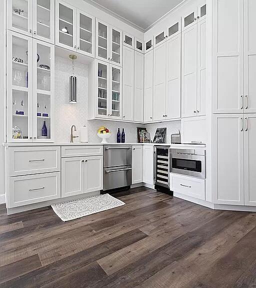 bar with wine cooler, dark wood finished floors, and a sink