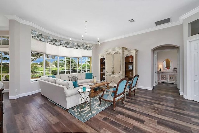 living area featuring dark wood-type flooring, visible vents, crown molding, and baseboards