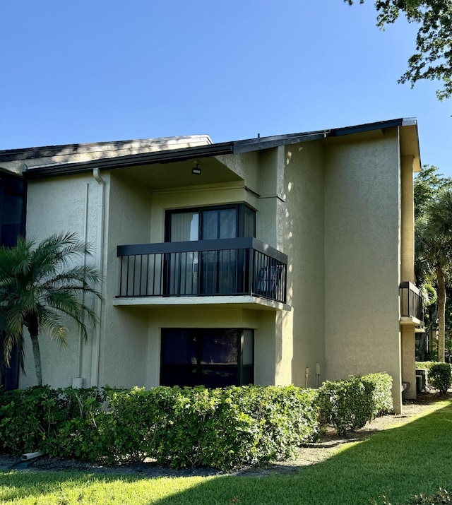 rear view of house featuring a balcony