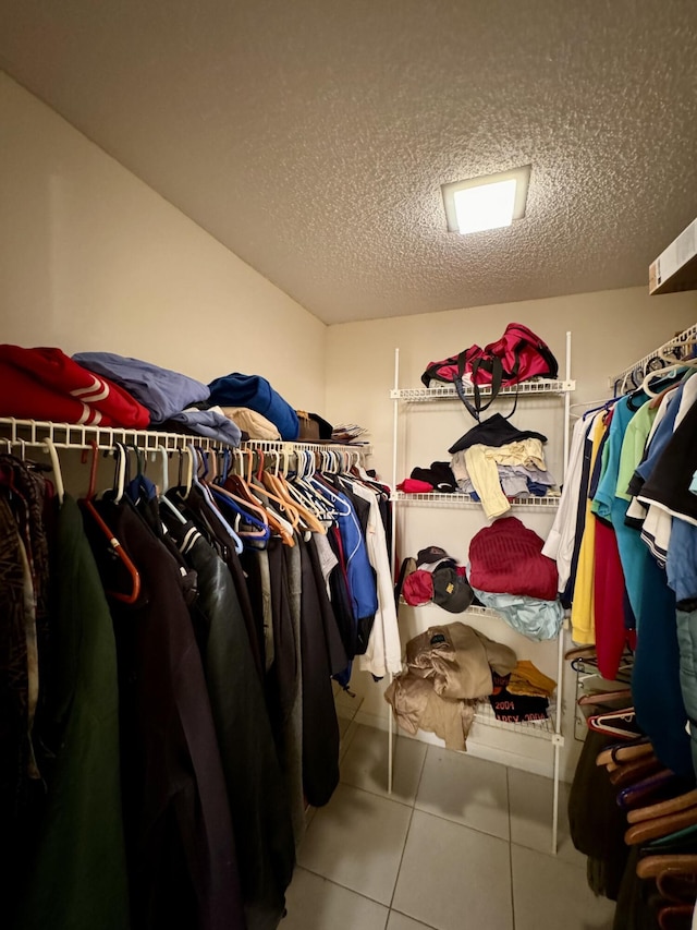 spacious closet with tile patterned flooring