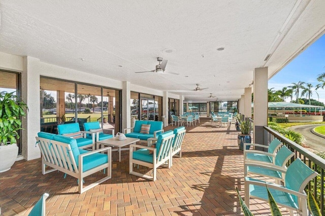 view of patio featuring an outdoor living space and ceiling fan