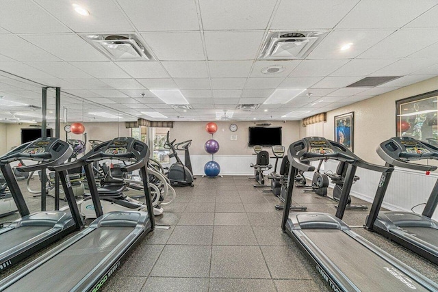 workout area with a paneled ceiling