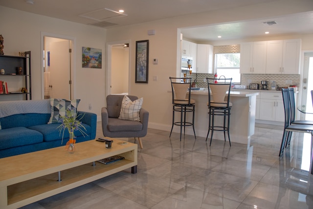 living room with light tile patterned floors