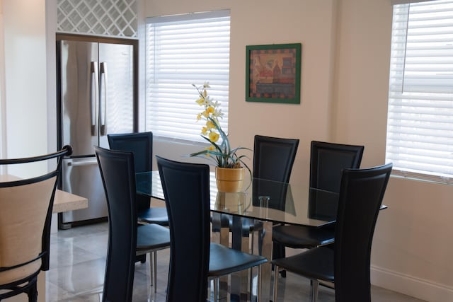 dining area featuring tile patterned flooring and a wealth of natural light