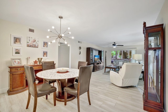 2004 Granada Dr Unit L2, Coconut Creek, FL 33066 - dining room with a chandelier, light wood finished floors, ceiling fan, and baseboards