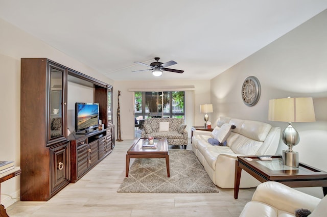 living room featuring ceiling fan and light wood-type flooring