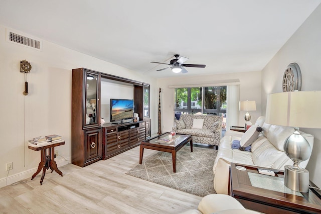 living room featuring ceiling fan and light wood-type flooring