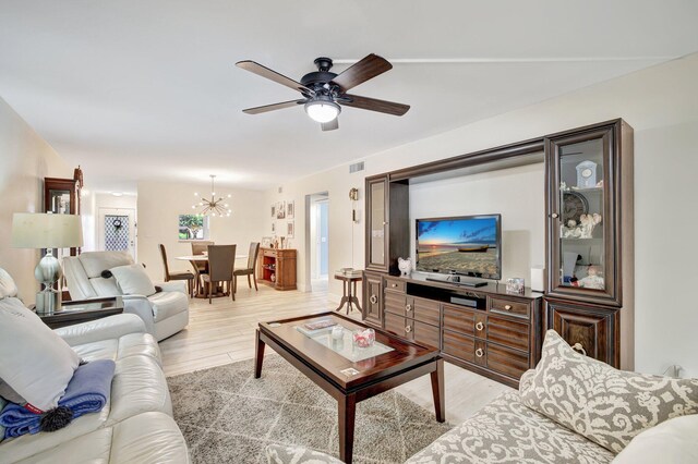 2004 Granada Dr Unit L2, Coconut Creek, FL 33066 - living room featuring a chandelier, light wood-type flooring, and a ceiling fan