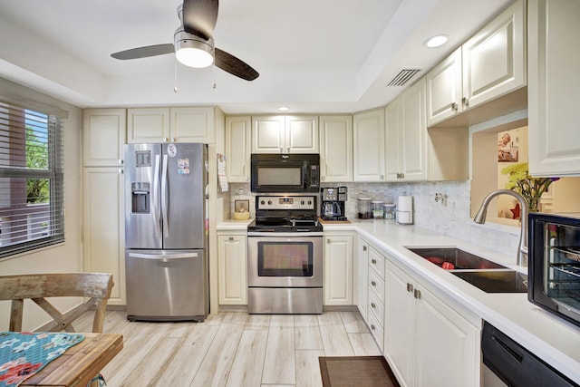 2004 Granada Dr Unit L2, Coconut Creek, FL 33066 - kitchen with stainless steel appliances, a sink, light countertops, backsplash, and recessed lighting