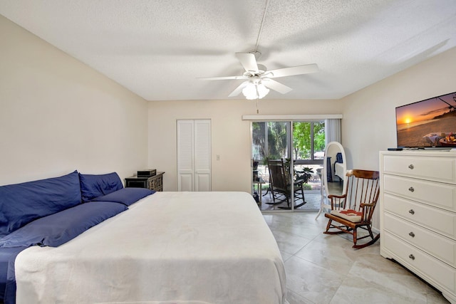 2004 Granada Dr Unit L2, Coconut Creek, FL 33066 - bedroom with access to outside, a textured ceiling, and a ceiling fan