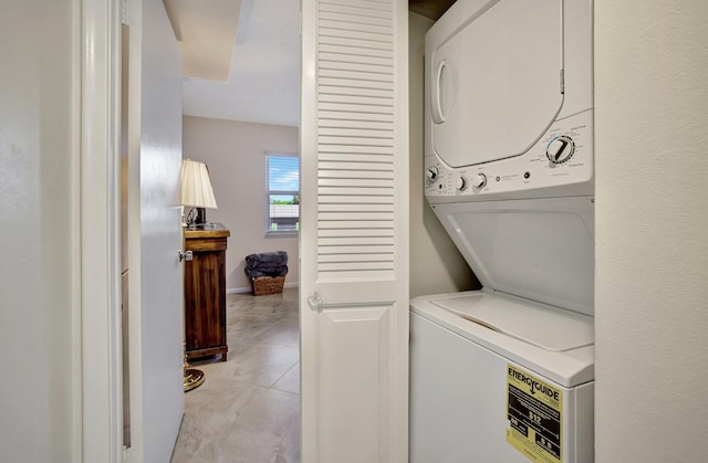 2004 Granada Dr Unit L2, Coconut Creek, FL 33066 - washroom featuring stacked washer and clothes dryer and light tile patterned floors