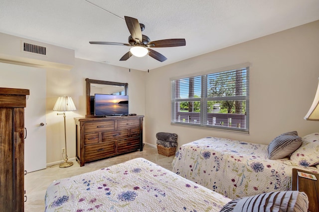 bedroom with light carpet and ceiling fan